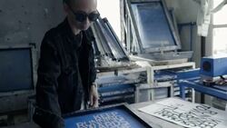 Fashion designers screen t-shirt, working at workspace Stock Footage