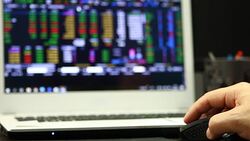 Using laptop trading stock exchange Stock Footage