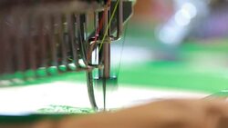 sewing machine or embroidery machine is used to create patterns on textiles Stock Footage
