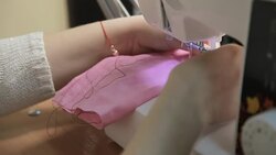 Woman sews on the sewing machine Stock Footage