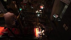 Craftsman working on huge old wooden brocade weaving looms Stock Footage