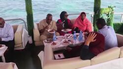 VOICED : Far from bombs Somalis try to relax on floating restaurant News Clip