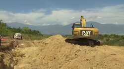 Volunteers bury quake and tsunami victims in mass grave  Instructional Video