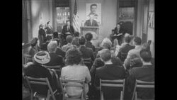 1960s: Man at podium addresses crowd of enthusiastic supporters for candidate Stock Footage