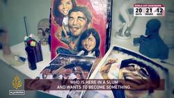 Argentine artist creates giant mural of football icon Maradona News Clip