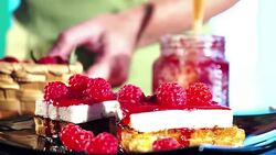 Making waffles with fresh raspberries Stock Footage