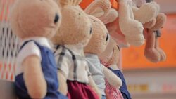 Teddy bears hanged on a shopping mall shelf. Stock Footage