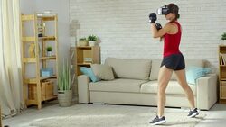 Sportswoman Practicing Kickboxing Movements at Home Stock Footage