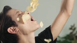 Eating potato chips in slow motion Stock Footage