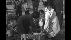 Economic Cooperation Administration head Foster observes women and children working in South Korea during Korean War News Clip