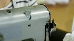 Young Woman Working at Sewing Factory Stock Footage