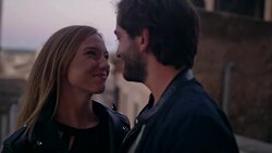 Happy couple on vacations. Old town panorama in background Stock Footage
