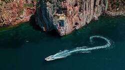 A Drone's Eye View of Porto Flavia: Dramatic Cliffs to Deep Blue (Copy) Stock Footage