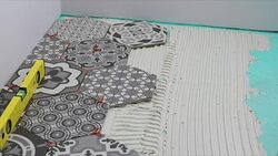 tiler applying tile adhesive on the floor Stock Footage