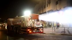 CLEAN : Qatari Red crescent volunteers sanitise the streets of Doha News Clip