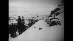 California, 1952: A train stuck in snowy San Francisco for three days receives aid as a reporter arrives to cover the story Stock Footage