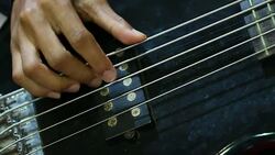 Music playing guitar concept : Young man people that guitarist plays on stage for show live in concert with light blur background Stock Footage