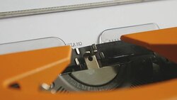 Close up footage of a person writing ISLAMOPHOBIA on an old typewriter, with sound Stock Footage