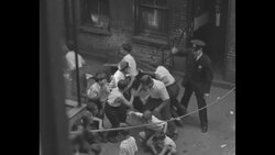Scenes of places in New York where gangsters grew up and committed their crimes; scenes of captured gangsters News Clip