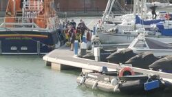 Body of man found by HM Coastguard taken ashore in Eastbourne News Clip