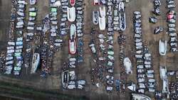 Aerial shot of confiscated small boats in Dover as David Lammy sets out people smuggling sanctions plan News Clip