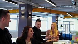Man tickles female colleague at the office meeting Stock Footage