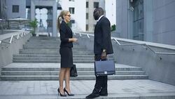 Business people communicating near office center, sharing news, partnership Stock Footage