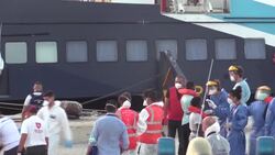 CLEAN : Italian coastguard with migrants from Banksy-funded rescue boat arrives at Lampedusa island News Clip