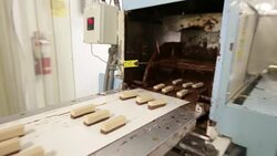 Candy on a Conveyer Belt with Chocolate Coating Stock Footage