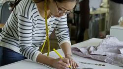 Young Woman Designing Clothes at Work Stock Footage