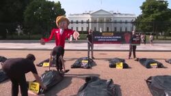 CLEAN : 'Free the vaccine': Activists protest outside White House as Biden hosts Merkel News Clip