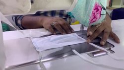 CLEAN : Coronavirus: workers sew protective masks at a factory in Sharjah News Clip