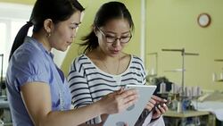Asian Designers Selecting Colors for Clothing Stock Footage