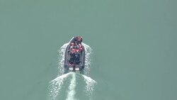 Aerial views of Border Force raft bringing migrants ashore News Clip