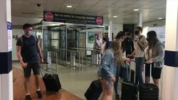 Passengers walking from East Midlands Airport News Clip