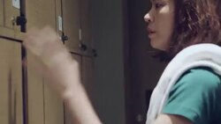 Young woman puts the bag in a locker storage in Gym Stock Footage