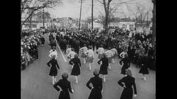 Atlantic Ocean, 1952: During Captain Carlsen's parade, high school majorettes strut before Carlsen gives a speech at the municipal building Stock Footage
