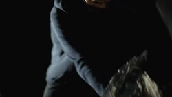 Serial killer in face mask opening car trunk and taking pistol, contract crime Stock Footage