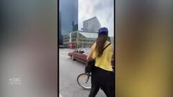 Protesters climb on car driving through Portage and Main protest Instructional Video