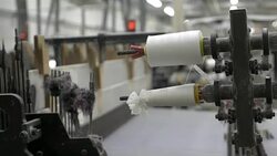 White Threads on a loom in  weaving loom machine in textile factory Stock Footage