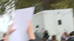 Assange supporters surround police van News Clip