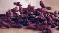 Mixed Super Foods Slow-Motion falling on wooden table, close up Stock Footage