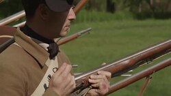 Colonial soldiers standing in rows with muskets ready Stock Footage