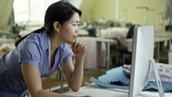 Asian Designer Working with Desktop Computer Stock Footage