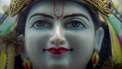 CLOSE ANGLE OF FACE OF STATUE OF HINDU GOD. RELIGIOUS. Stock Footage