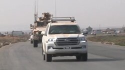 CLEAN : Syria: US military vehicles seen near the town of Tall Tamr News Clip