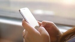 Woman using the phone in the train in 4k slow motion 60fps Stock Footage