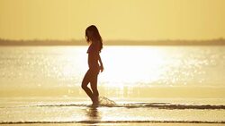 Happy African American Asian Chinese girls on beach Stock Footage