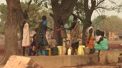 Women drawing water in South Sudan Stock Footage