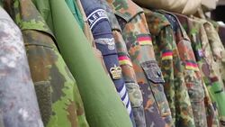Closer look of the patches on the camouflage uniform Stock Footage